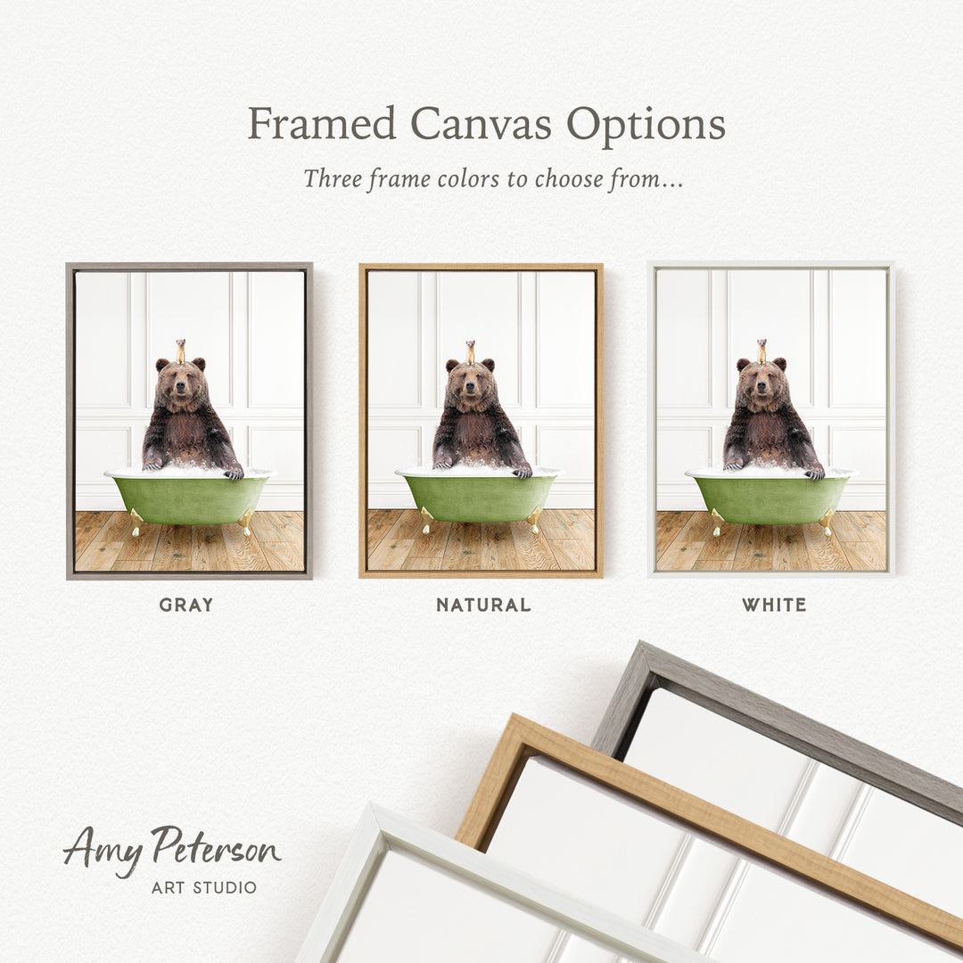 three framed canvas options featuring a bear sitting in a bathtub, each with a different frame color: gray, natural, and white.
