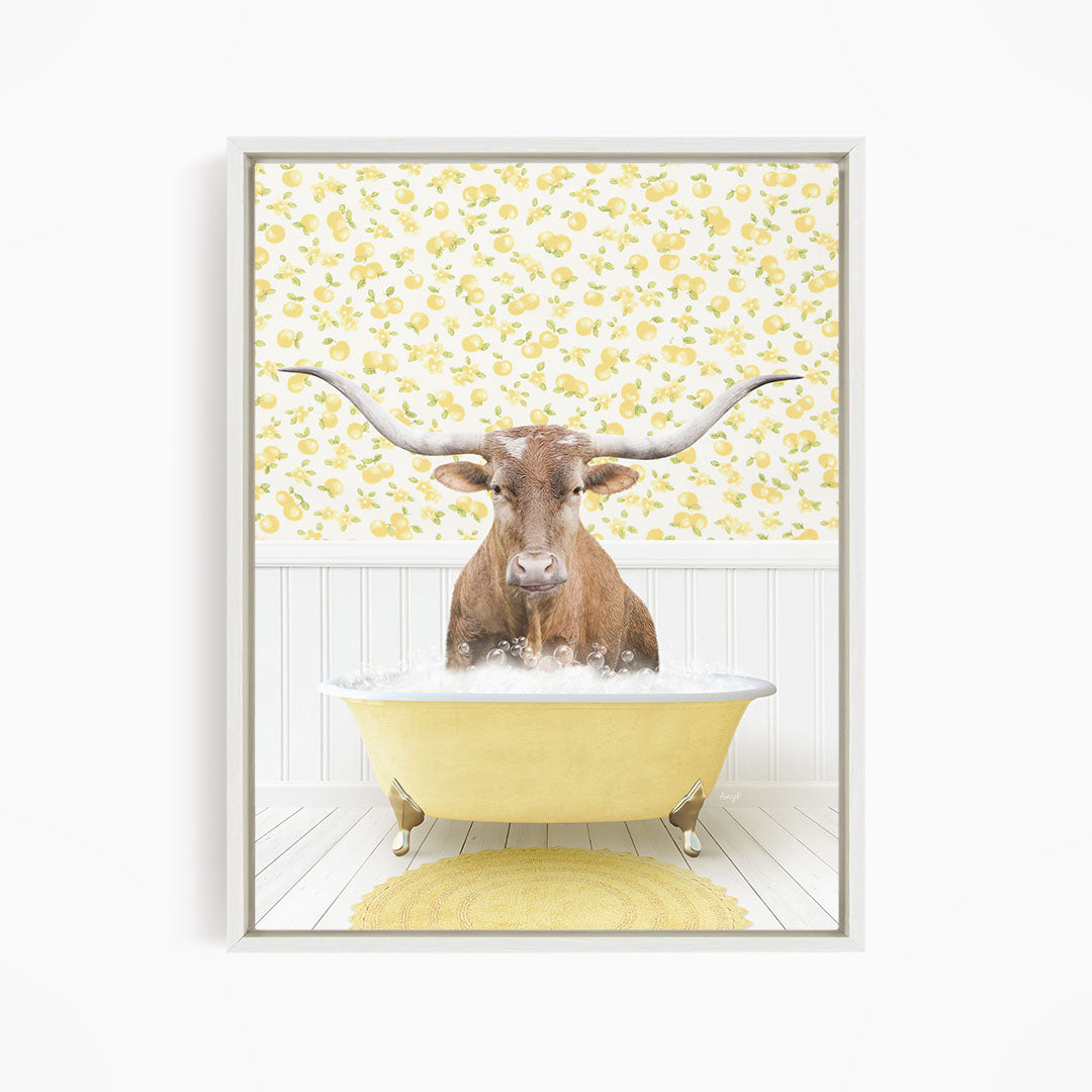 A brown steer with large horns is sitting in a yellow bathtub filled with water, surrounded by a yellow floral pattern on the wall behind it.