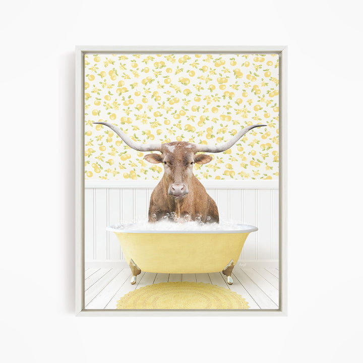 A brown steer with large horns is sitting in a yellow bathtub filled with water, surrounded by a yellow floral pattern on the wall behind it.