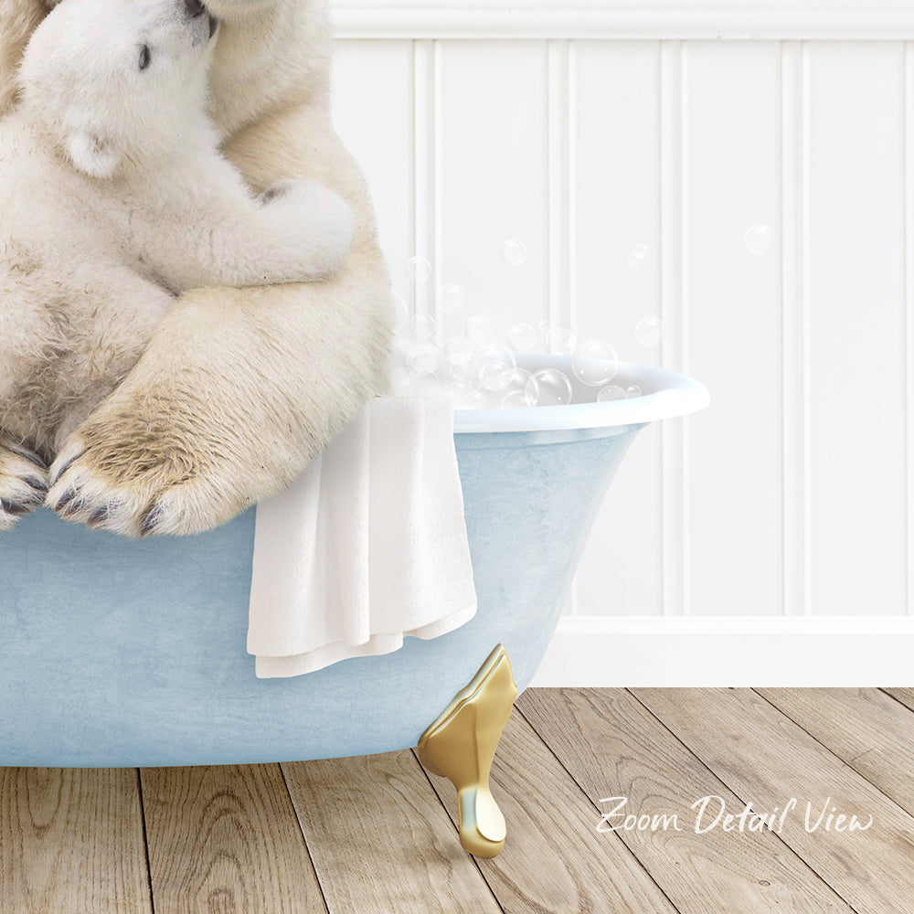 A polar bear sitting in a blue bathtub, surrounded by bubbles, with a towel and gold bathtub leg visible.
