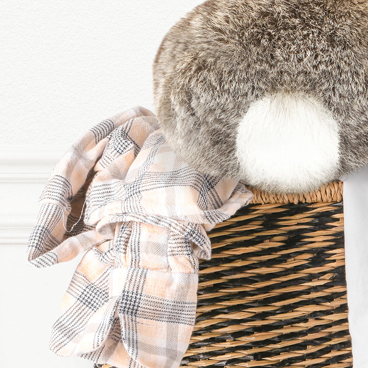 a stuffed animal sitting on top of a basket