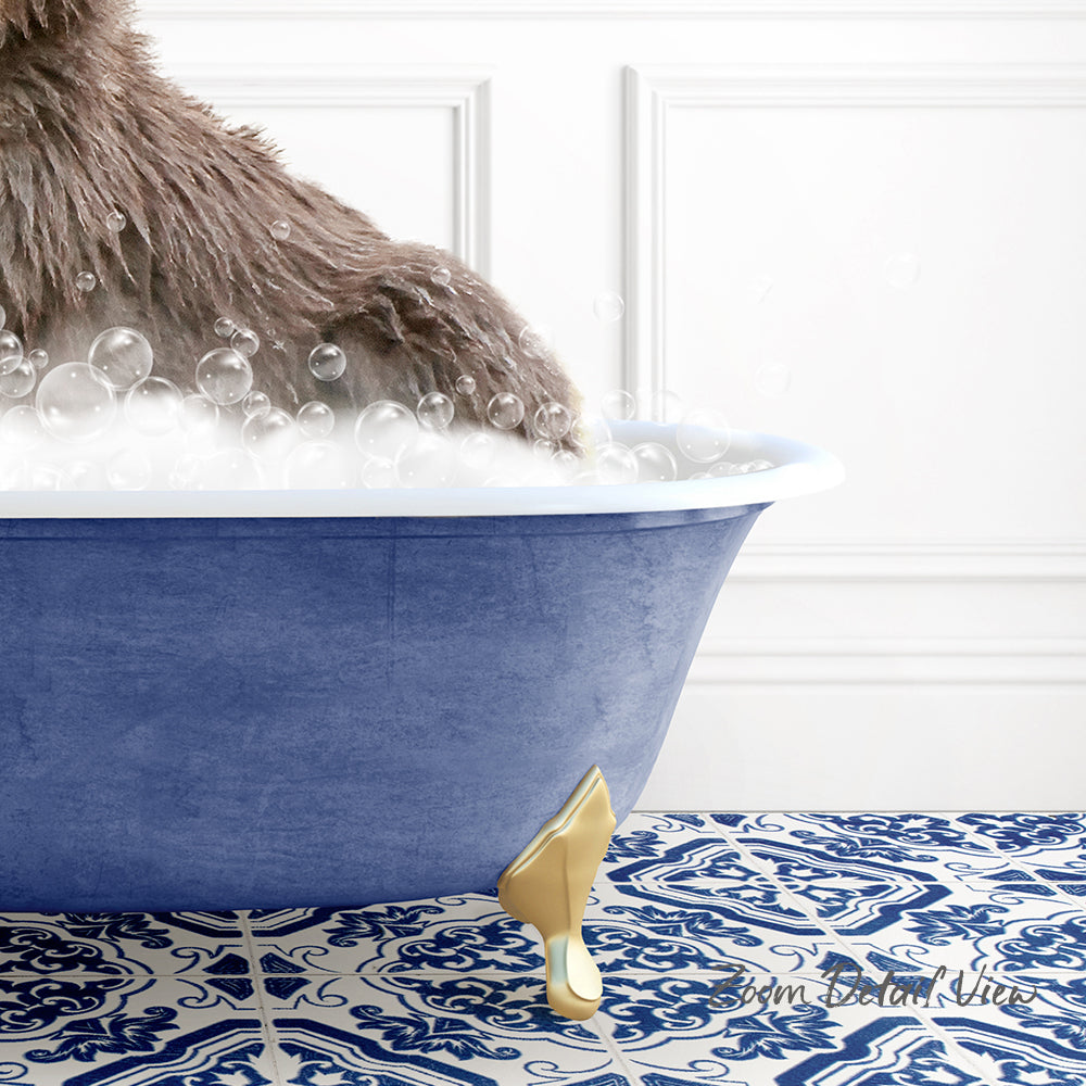 A fluffy brown dog is sitting in a blue bathtub filled with bubbles, with a gold bathtub faucet visible.