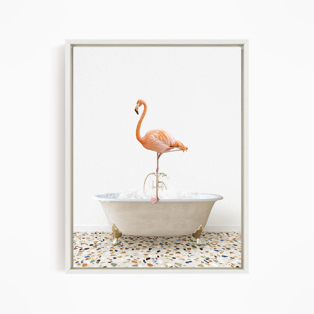 A pink flamingo standing on one leg in a white bathtub filled with water.