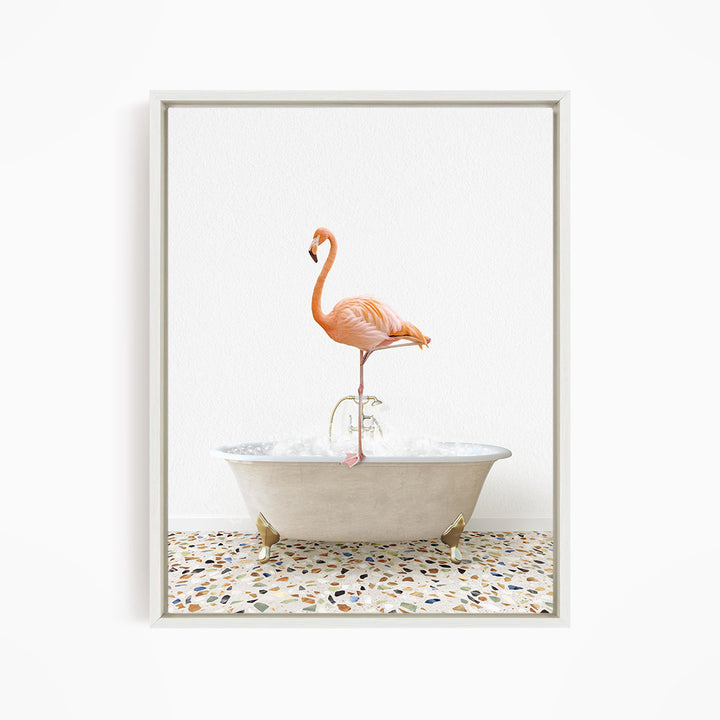 A pink flamingo standing on one leg in a white bathtub filled with water.