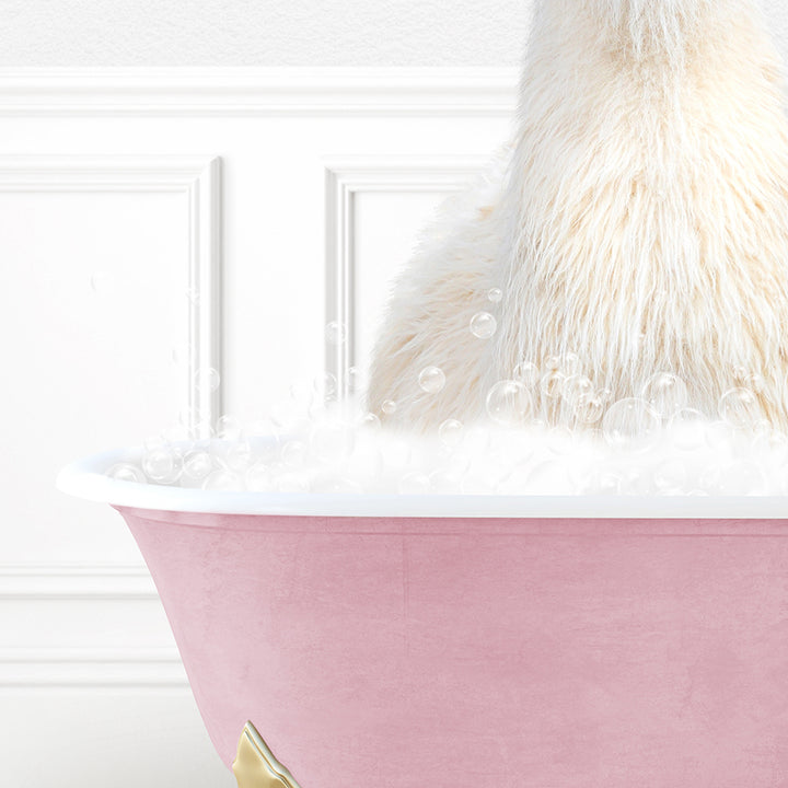 a stuffed animal sitting in a bathtub filled with bubbles