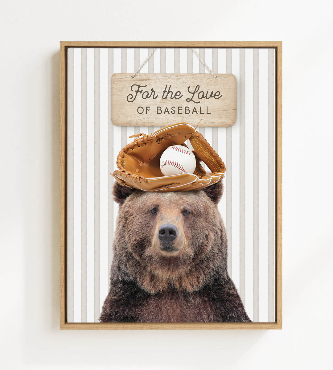 A framed image of a brown bear wearing a baseball glove and holding a baseball, with a wooden sign above that says "For the Love of Baseball".