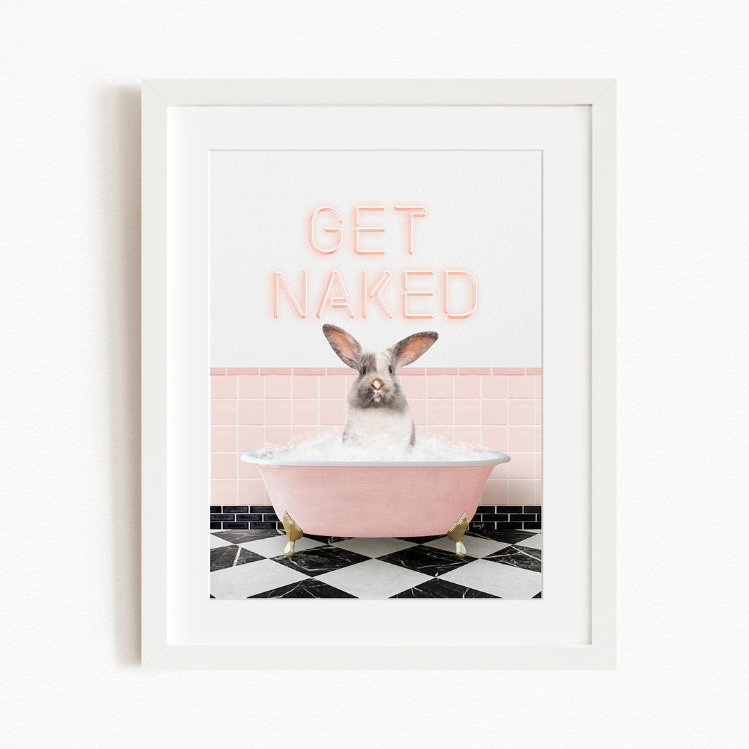A framed image depicting a rabbit sitting in a pink bathtub filled with bubbles, with the text "GET NAKED" displayed above it.