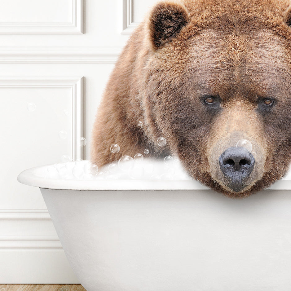 a large brown bear sitting in a bath tub