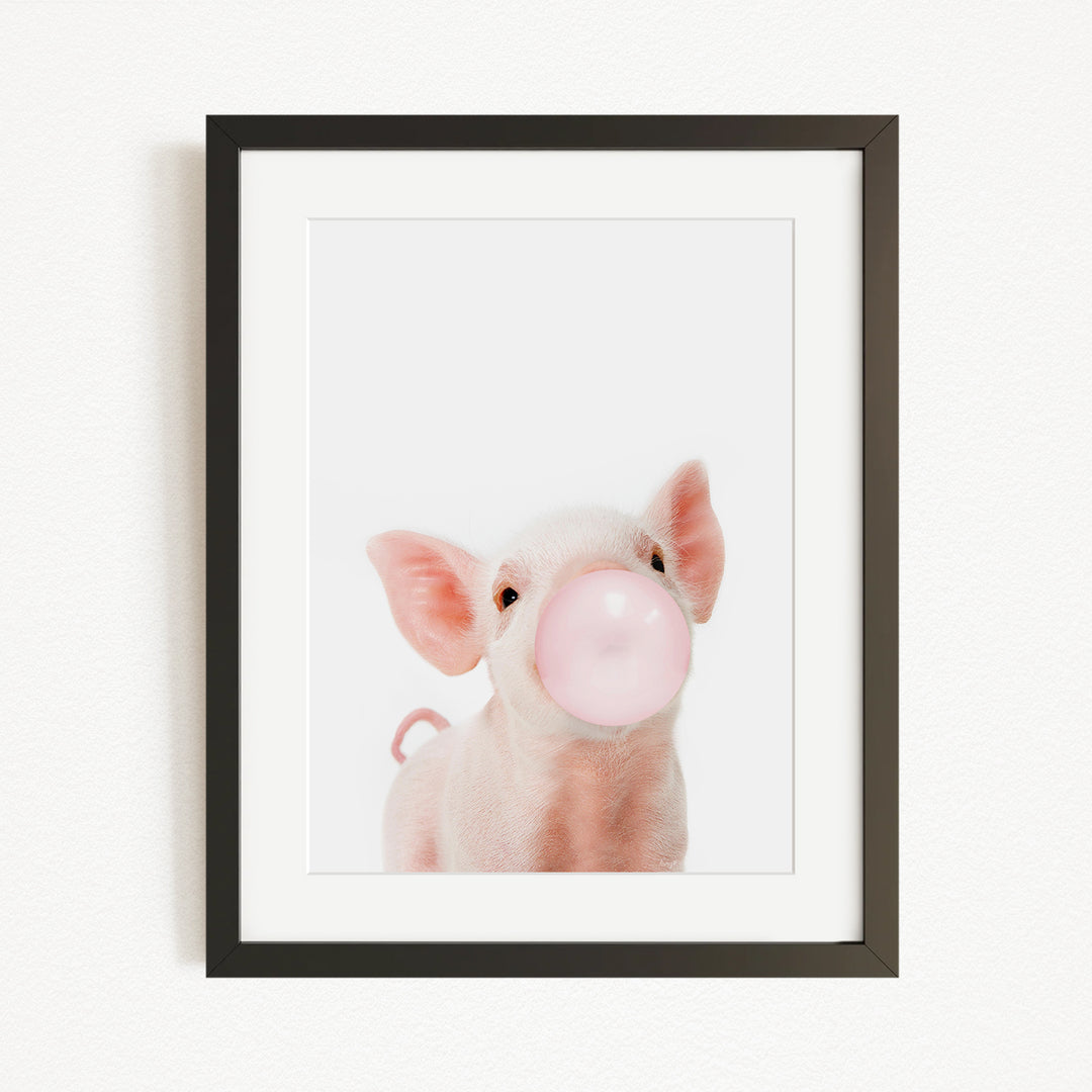 A cute pig blowing a bubble with a pink bubble gum bubble.