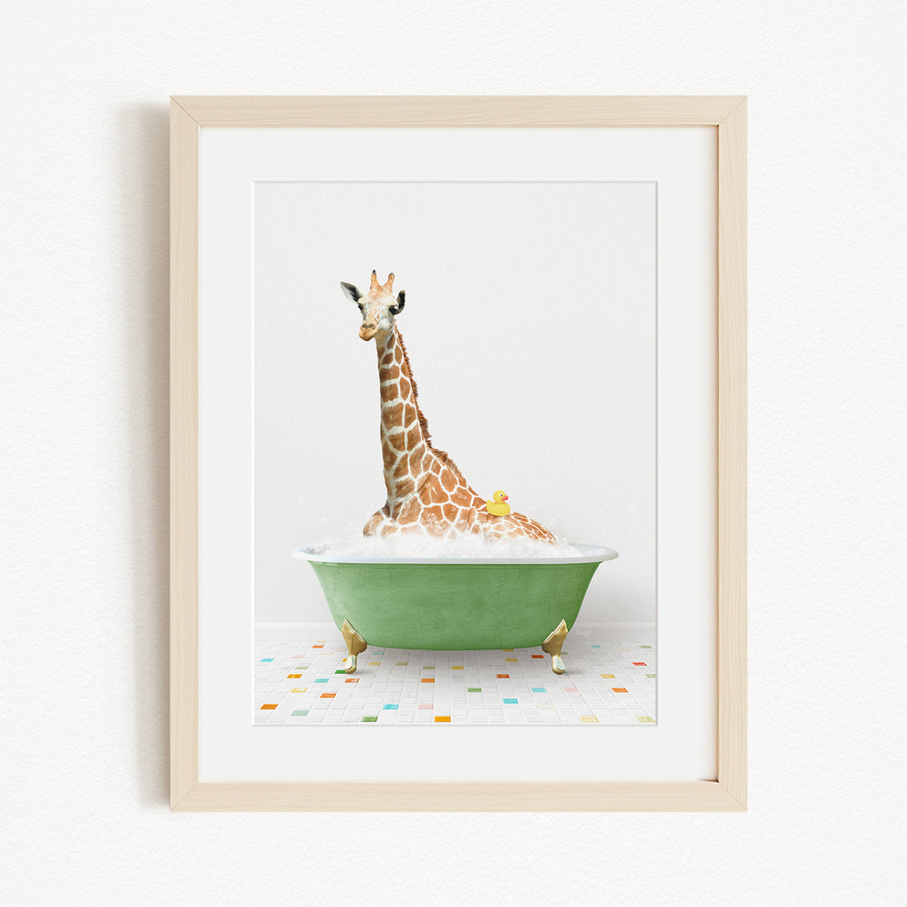 A giraffe sitting in a green bathtub filled with bubbles, surrounded by colorful tiles on the floor.