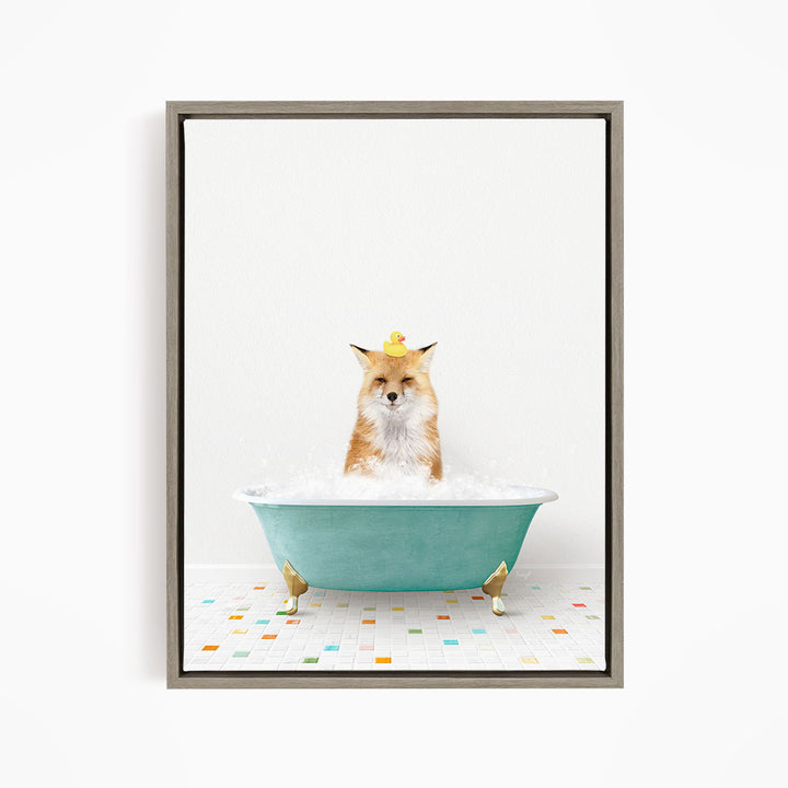 A fox is sitting in a green bathtub filled with bubbles, with a rubber duck perched on its head.