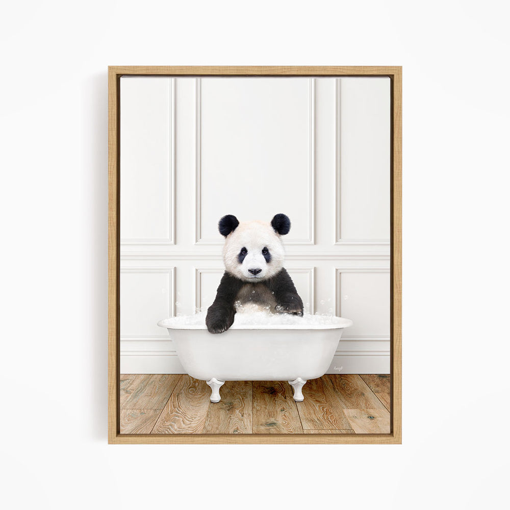 A panda bear sitting in a white bathtub, surrounded by a wooden floor and white walls.
