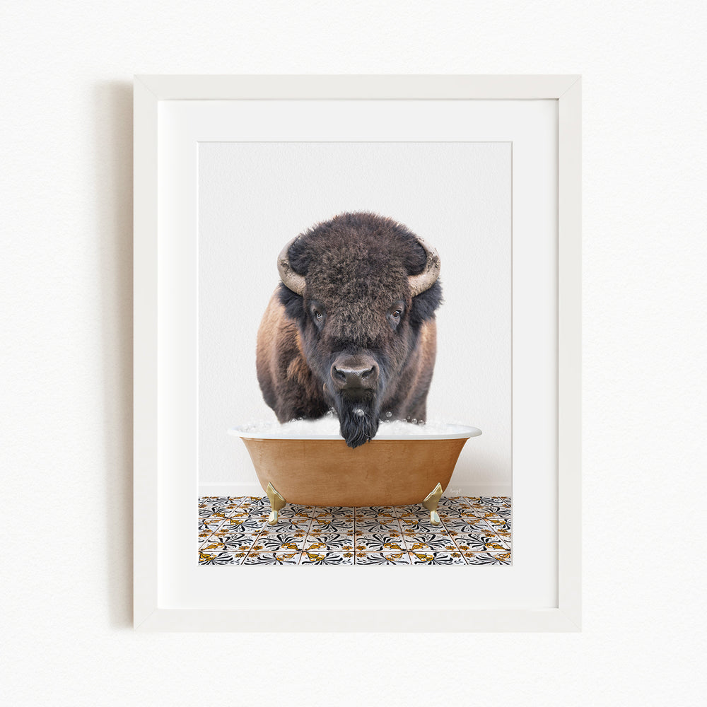 A buffalo with large horns is standing in a bathtub filled with water, appearing to be drinking from it.