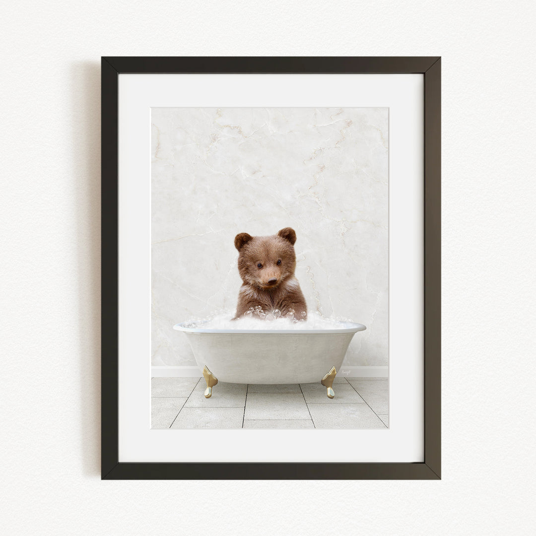 A brown bear sitting in a white bathtub filled with bubbles, creating a whimsical and playful scene.