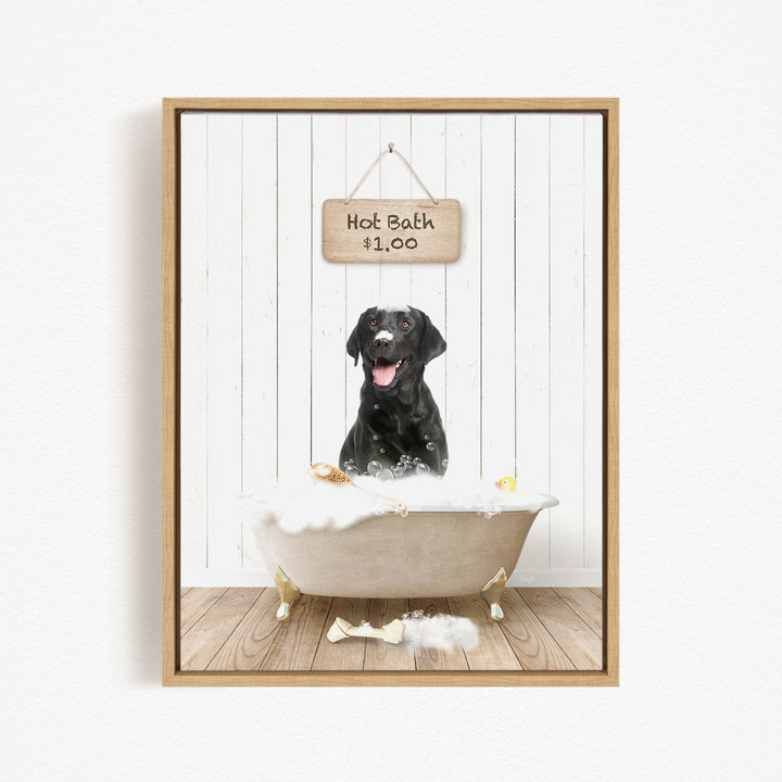 A black dog sitting in a bathtub filled with bubbles, with a sign above the tub indicating a hot bath for $1.00.