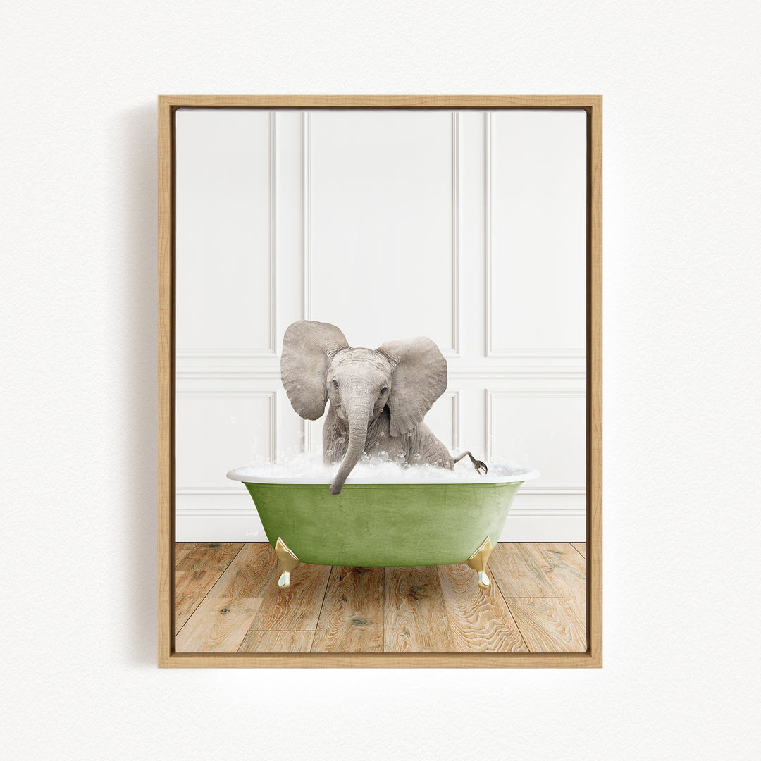 A baby elephant sitting in a green bathtub filled with water, surrounded by a white wall and wooden floor.