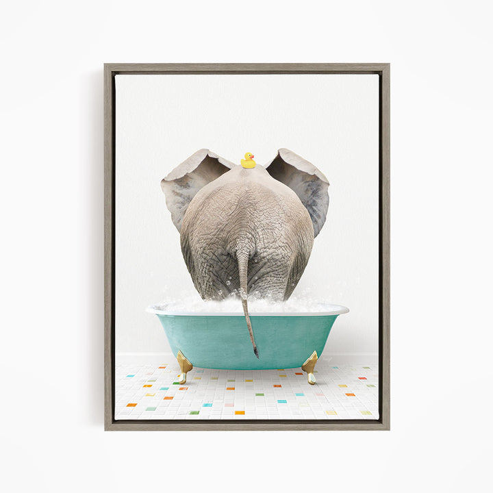An elephant is taking a bath in a blue tub, with a yellow rubber duck floating on its head.