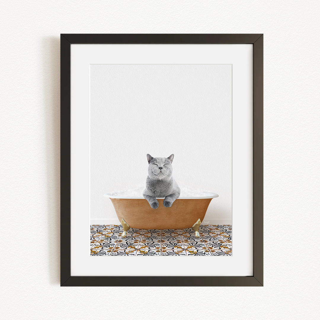 A gray cat sitting in a bathtub filled with bubbles, with a patterned tile floor in the background.