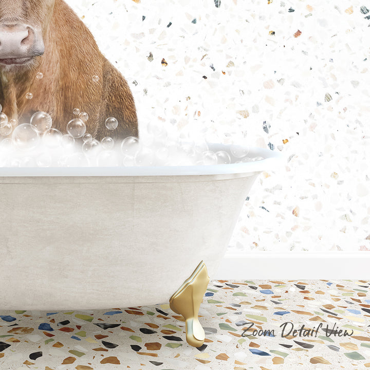 A brown cow is standing in a white bathtub filled with bubbles, with a mosaic floor in the background.