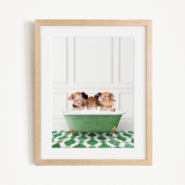 Three adorable pigs sitting in a green bathtub, enjoying a relaxing bath.