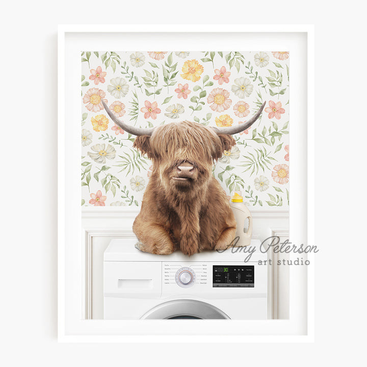 a brown cow sitting on top of a washing machine