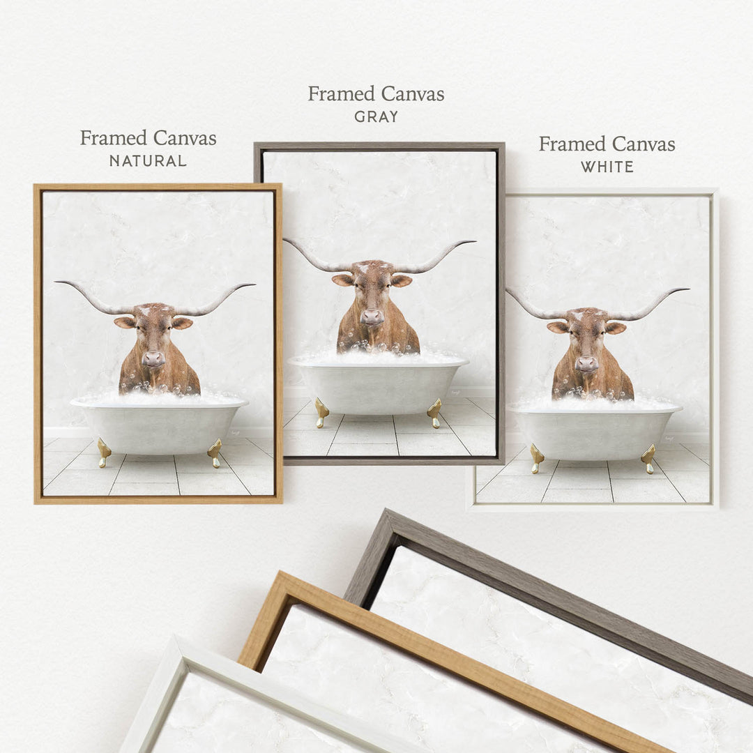 three framed pictures of a bull with long horns sitting in a bathtub, each with a different color frame.