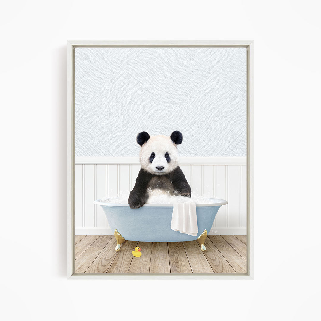 A panda bear sitting in a blue bathtub filled with water, surrounded by rubber duckies.