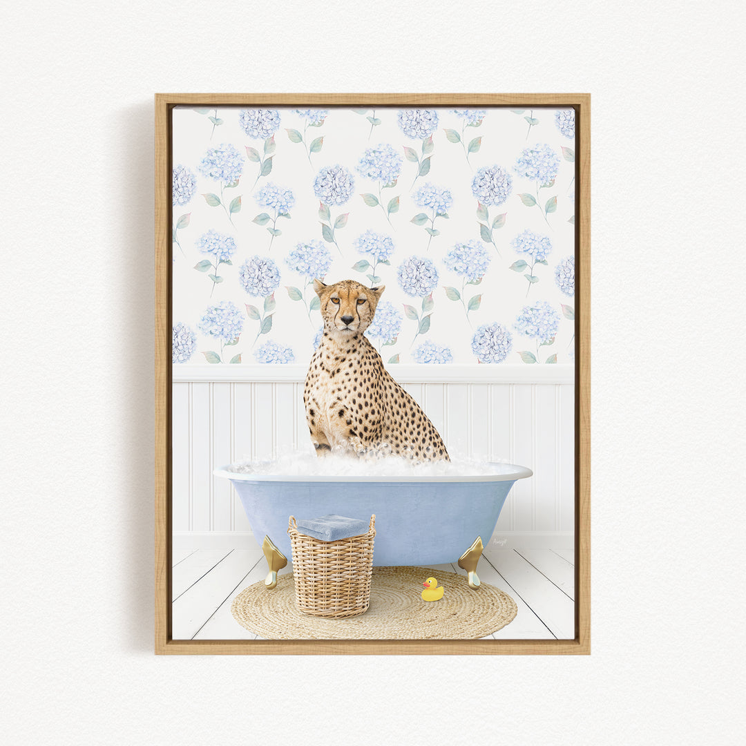 A cheetah sitting in a blue bathtub filled with water, surrounded by a wicker basket and rubber duckies.