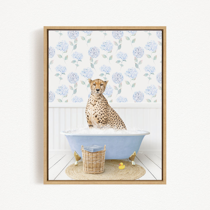 A cheetah sitting in a blue bathtub filled with water, surrounded by a wicker basket and rubber duckies.