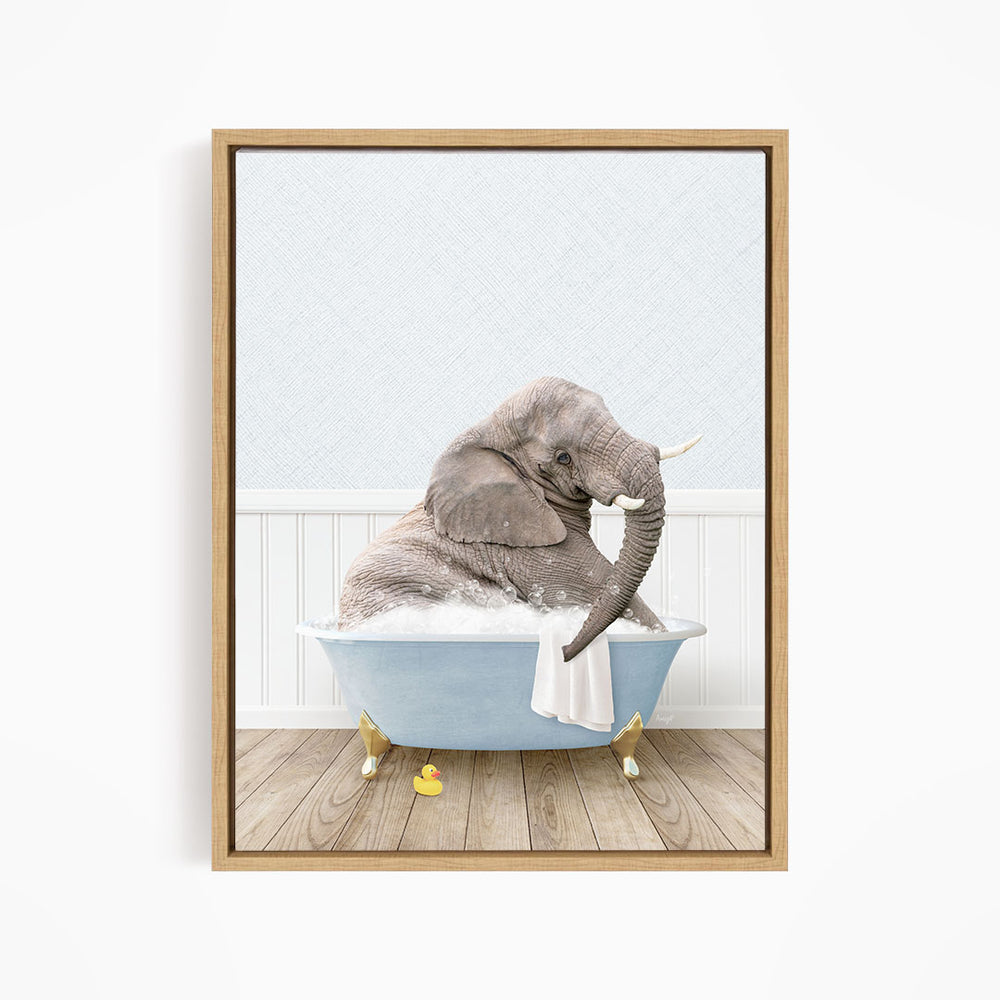 A gray elephant is sitting in a blue bathtub filled with water, surrounded by yellow rubber ducks.