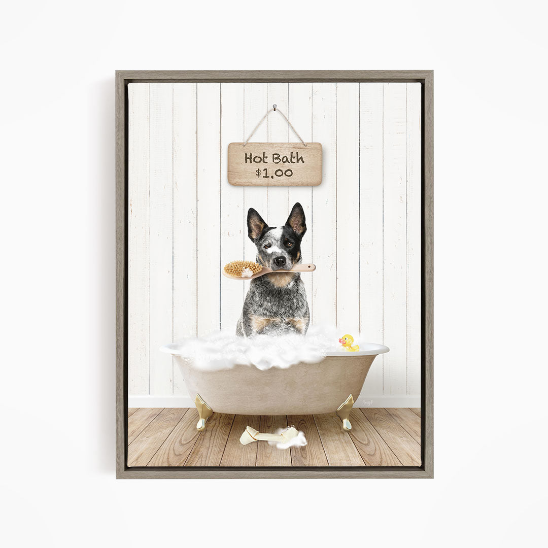 A black and white dog sitting in a white bathtub, holding a brush in its mouth, with a sign above the bathtub that reads "Hot Bath $1.00".