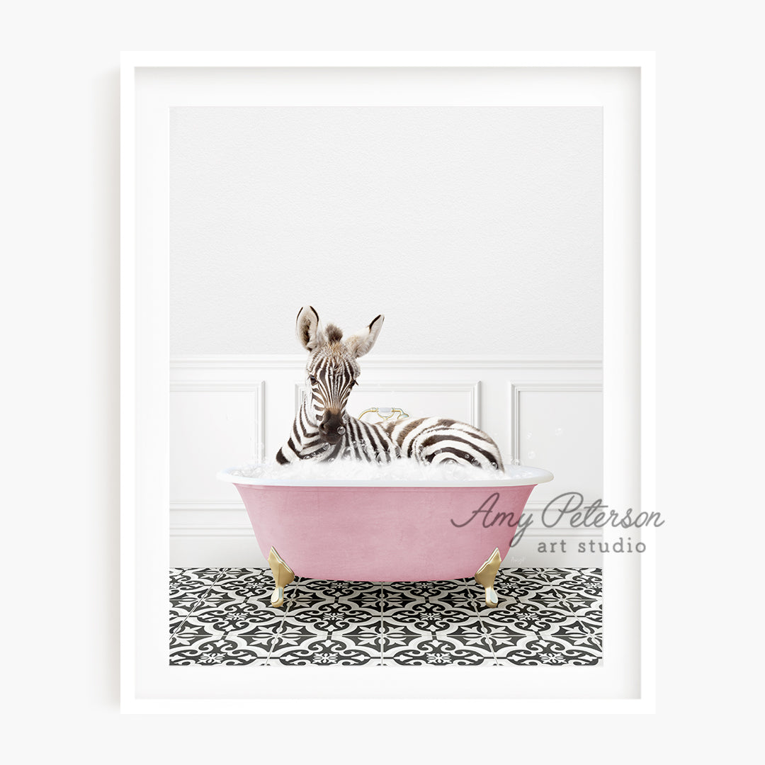 a zebra laying down in a pink bath tub