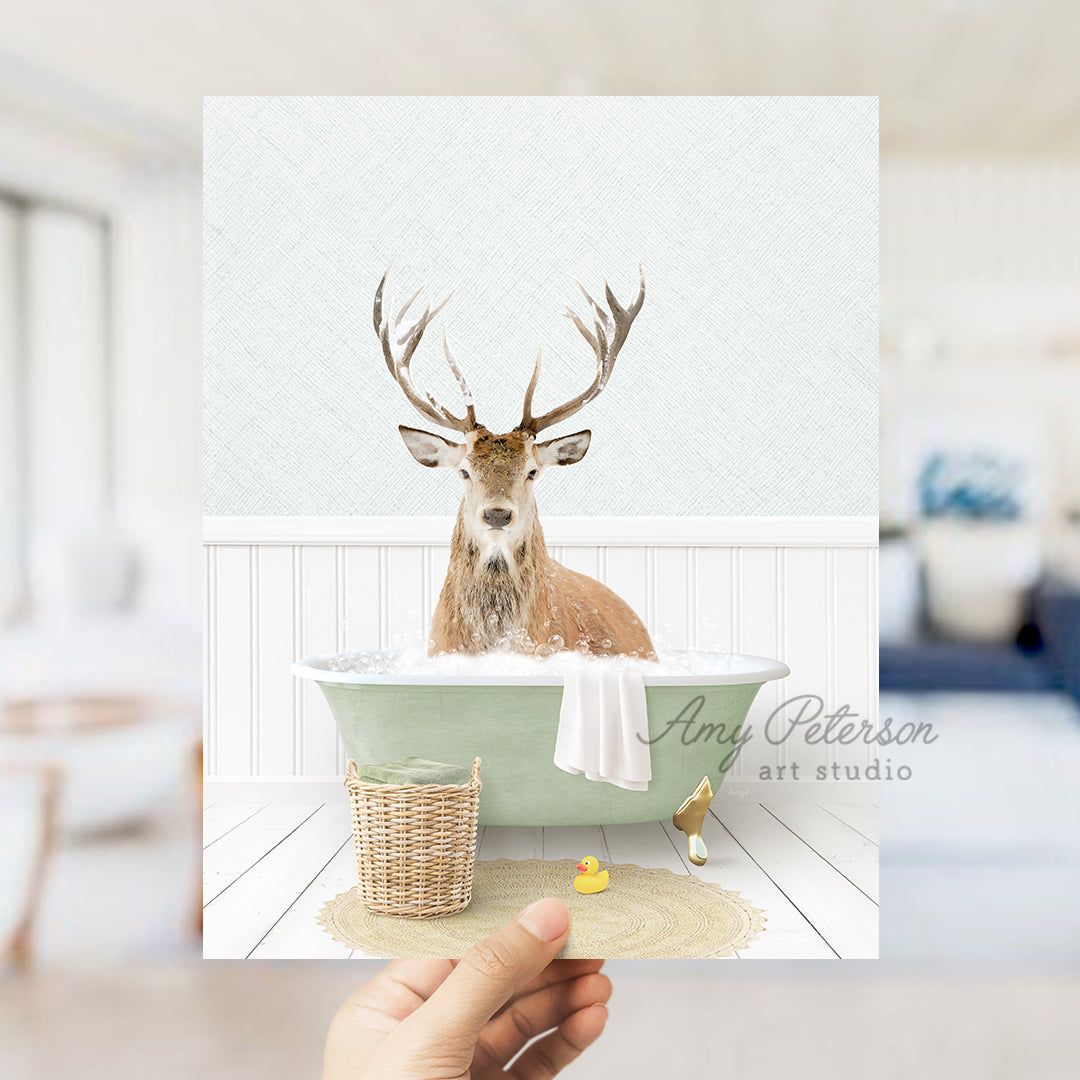 a person holding up a card with a picture of a deer in a bathtub