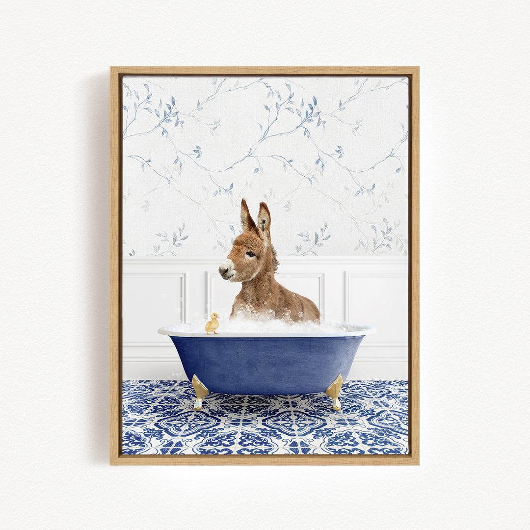 A donkey is sitting in a blue bathtub filled with water, surrounded by a patterned tile floor and a floral wallpaper background.