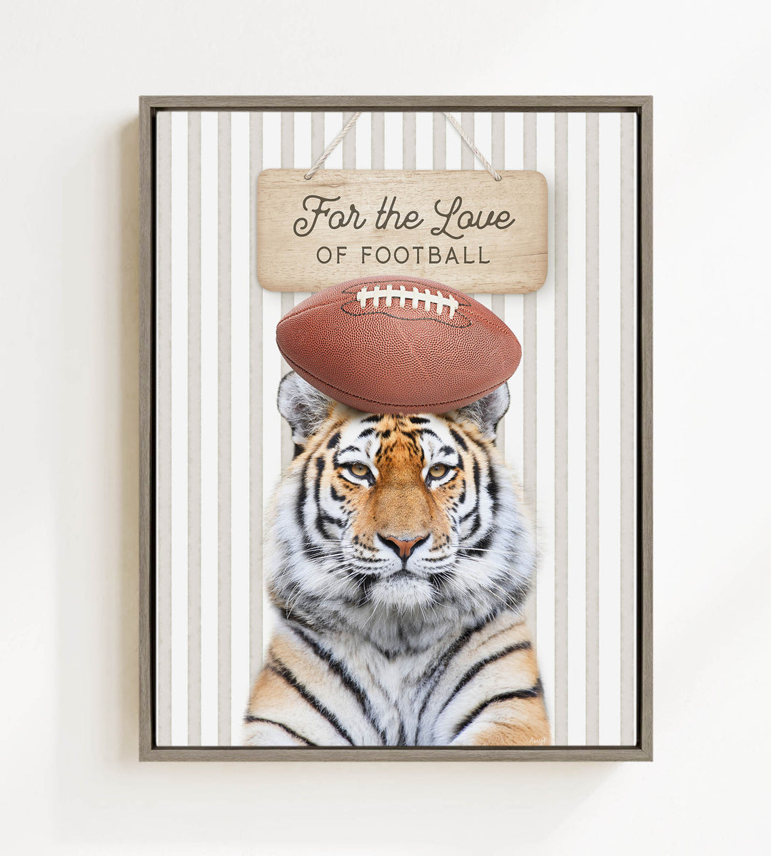 A tiger is standing in front of a sign that says "For the Love of Football".