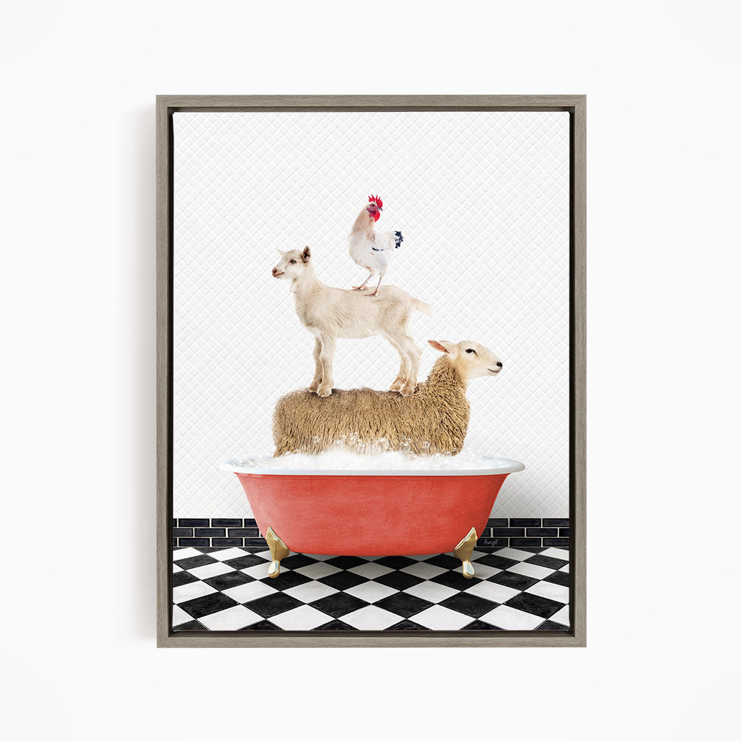 A framed image depicting a sheep standing on a goat's back, with a rooster perched on top of the goat, all atop a red bathtub.
