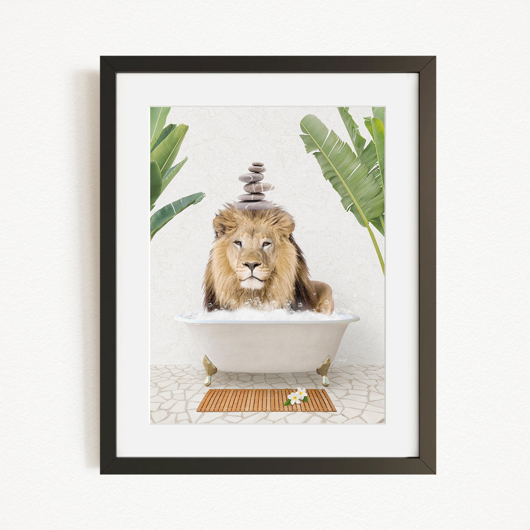 A framed image depicting a lion sitting in a bathtub filled with water, surrounded by tropical plants.