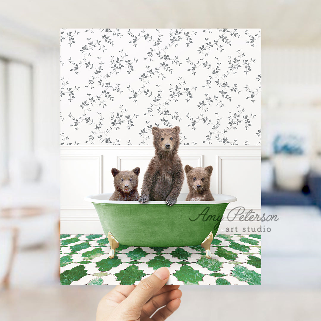 a person holding up a card with three bears in a bathtub