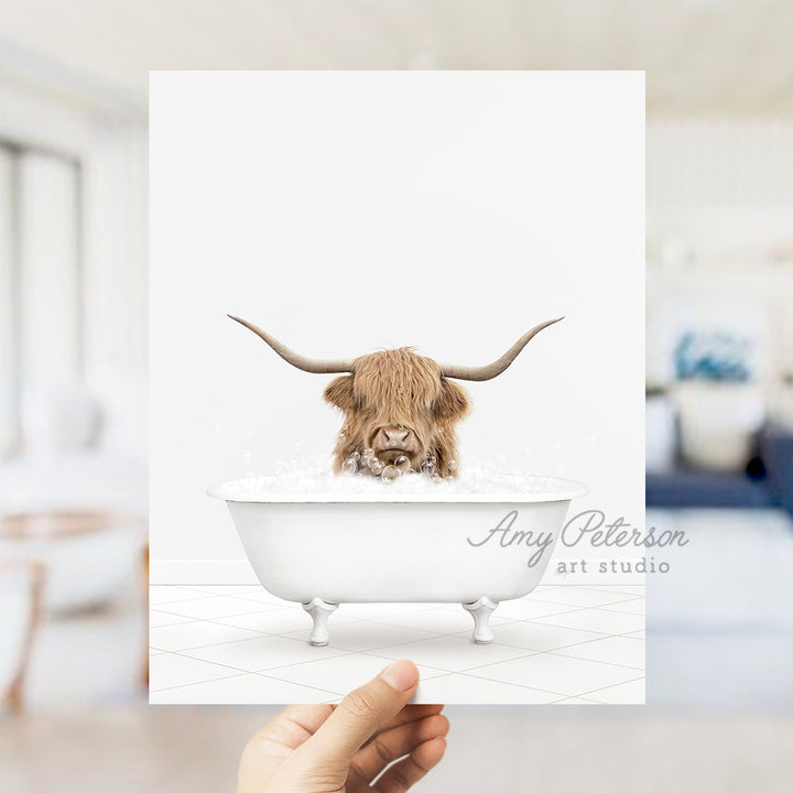 a person holding up a card with a picture of a bull in a bathtub