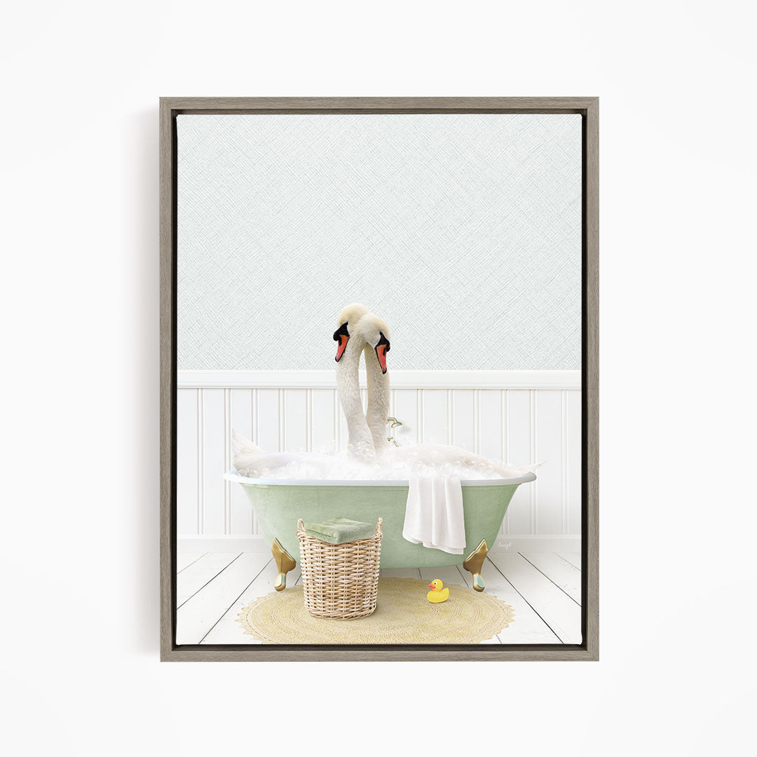 A pair of swans sitting in a green bathtub filled with bubbles, surrounded by a yellow rubber duck and a woven basket.