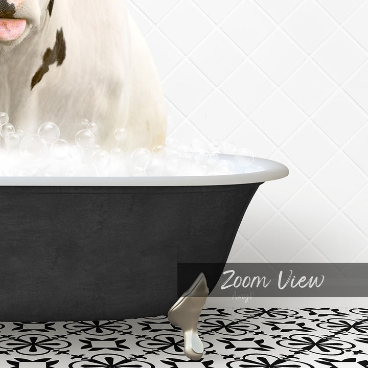 A white cow with black spots is standing in a black bathtub filled with bubbles, with a black and white patterned floor in the foreground.