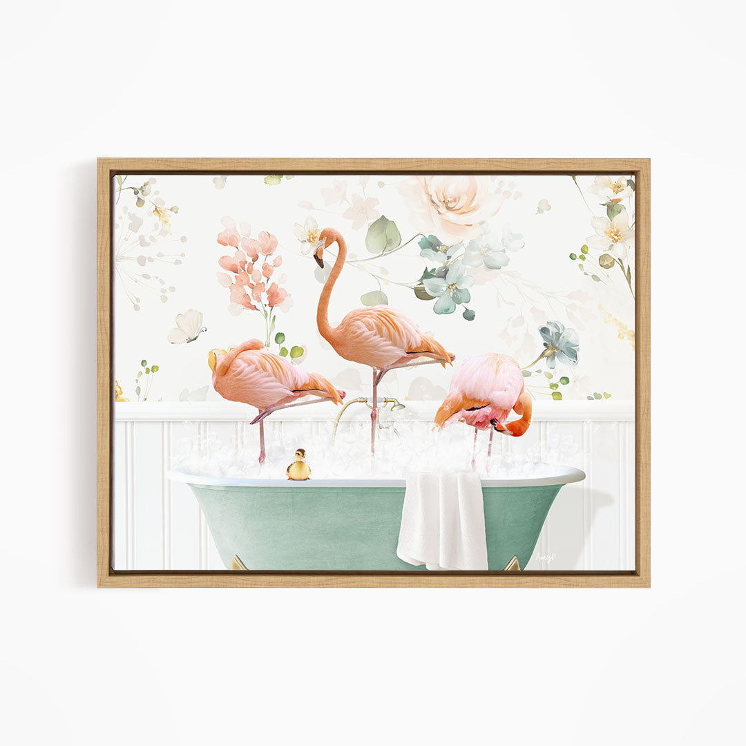A framed print depicting three pink flamingos standing in a green bathtub filled with water, surrounded by a floral pattern.