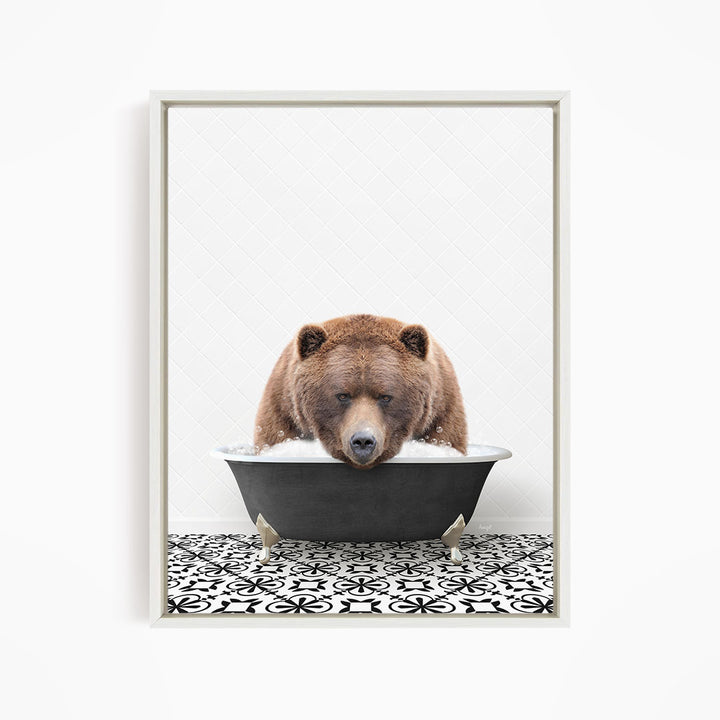 A brown bear is sitting in a bathtub filled with water, appearing to be enjoying the bath.