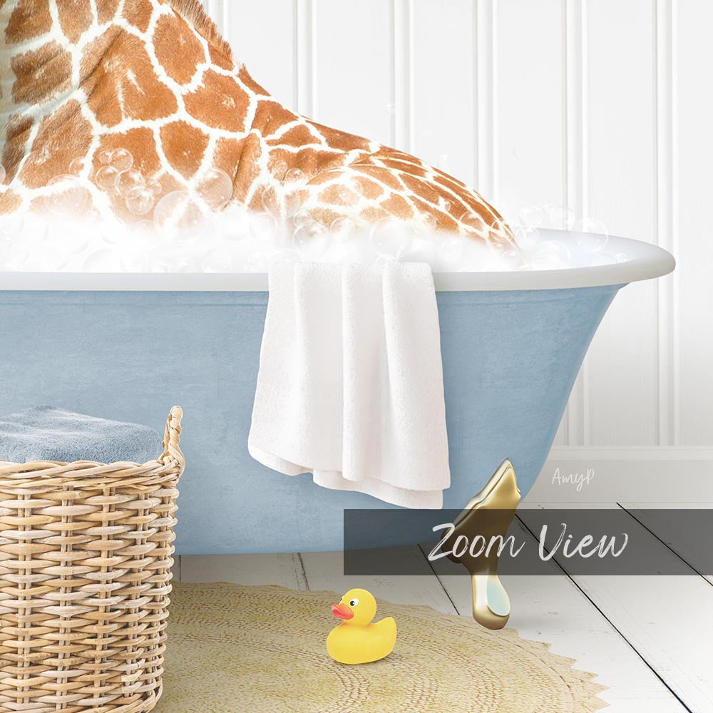 A giraffe is sitting in a blue bathtub filled with bubbles, surrounded by a wicker basket, a yellow rubber duck, and a towel.