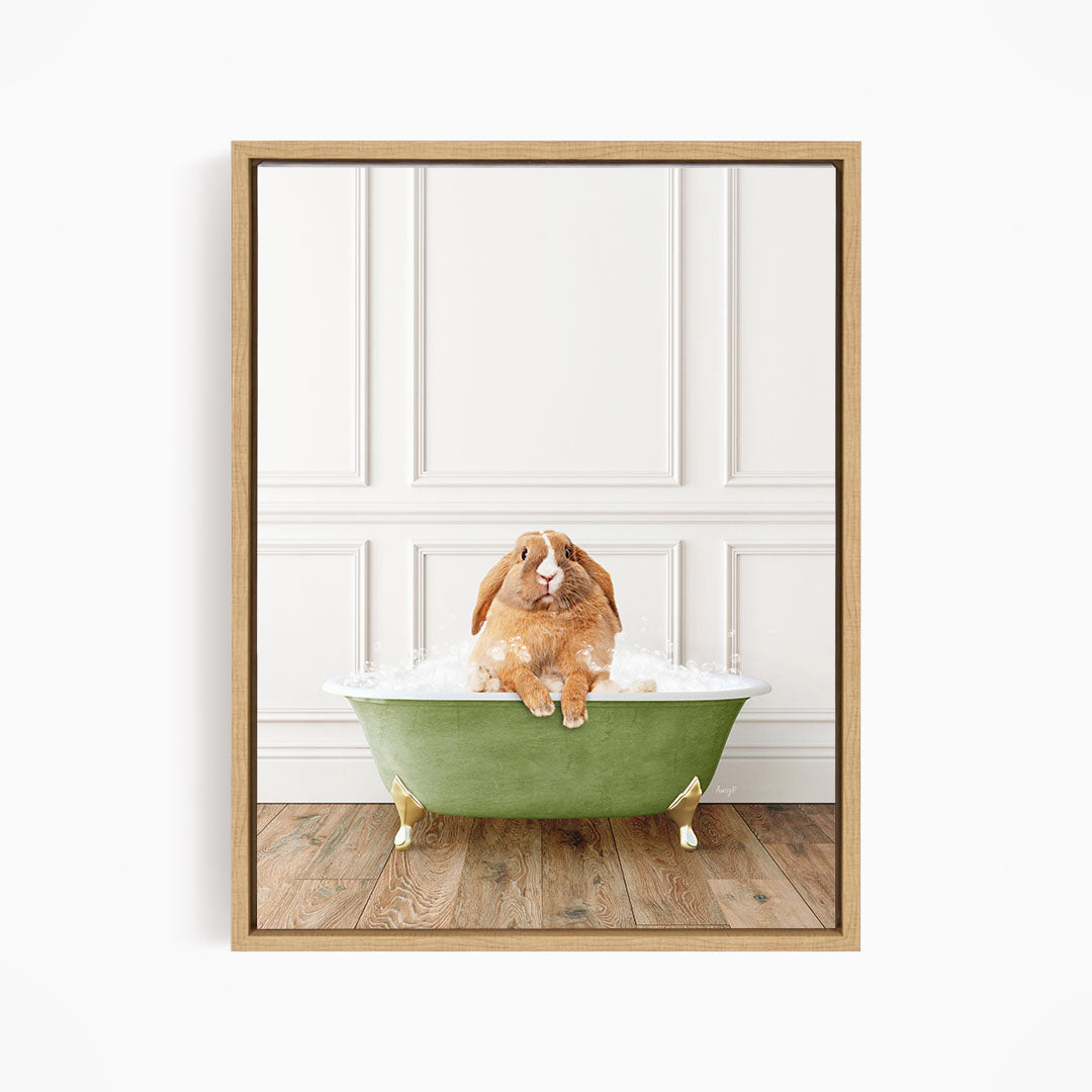 A brown rabbit sitting in a green bathtub filled with water, with a white wall and wooden floor in the background.
