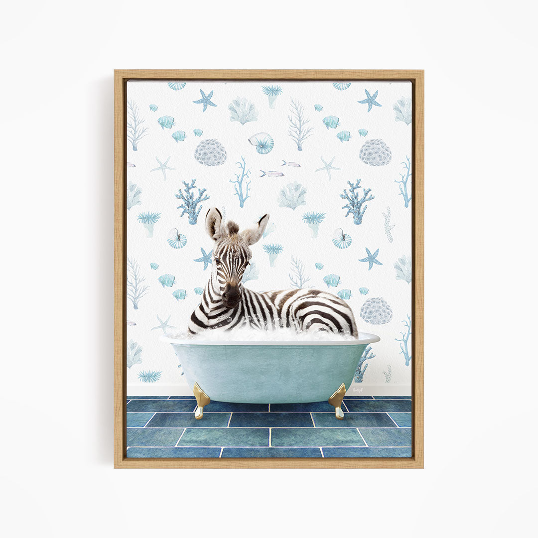 A zebra is sitting in a blue bathtub, surrounded by a pattern of seashells and starfish on the wall behind it.