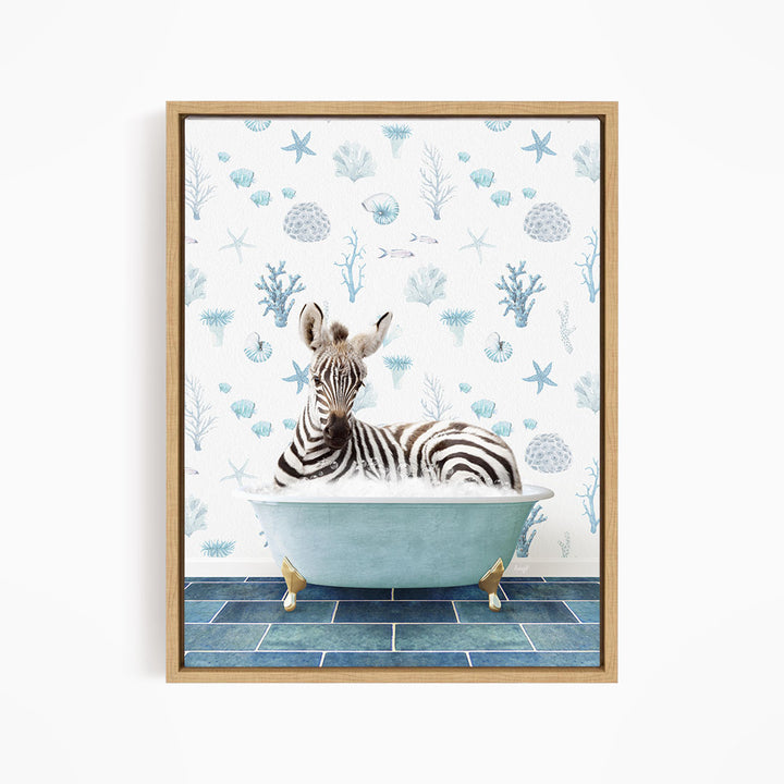 A zebra is sitting in a blue bathtub, surrounded by a pattern of seashells and starfish on the wall behind it.