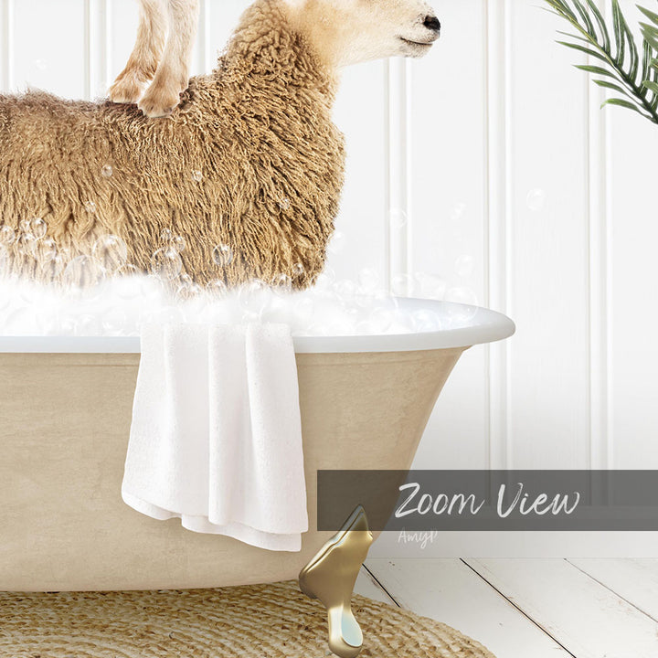 A fluffy brown sheep is sitting in a bathtub filled with water, with a towel hanging on the side and a plant visible in the background.