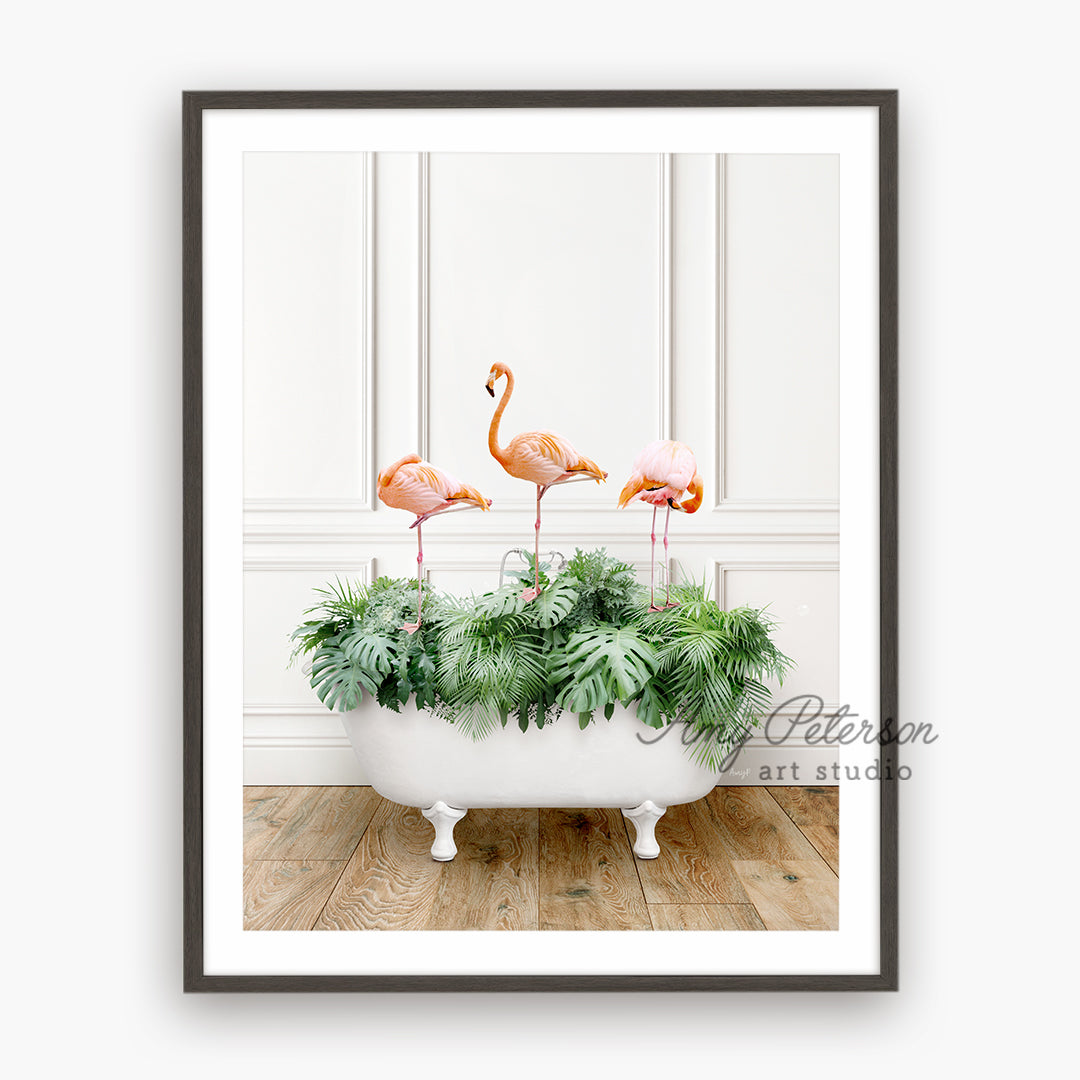 three flamingos in a bathtub with plants in it