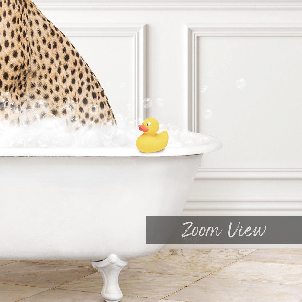 A leopard print bathtub filled with bubbles, with a yellow rubber duck sitting on the edge.